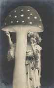 Lady_stands_beside_amanita_puffing_joint.jpg