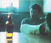 Jim_with_beer_bottle_on_table.jpg