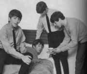 Beatles_give_John_some_tea.jpg