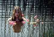 Nude_hippie_girl_in_water_up_to_head.jpg