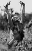 Topless_hippie_girl_in_field.jpg