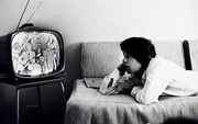 Mick_Jagger_watching_Beatles_on_TV.jpg