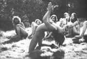 Nude_hippie_girl_bent_over_backwards.jpg