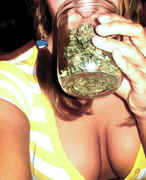 Girl_with_cleavage_smelling_weed.jpg