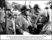 Hippie_girl_stands_in_front_of_National_Guardsmen.jpg