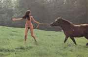 Naked_girl_in_field_with_horse.jpg
