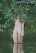 Nude_hippie_girl_in_water.jpg