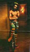 Peter_Tosh_with_joint_on_bike.jpg