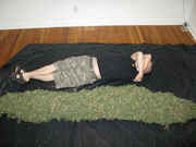 Man_beside_huge_pile_of_weed.jpg